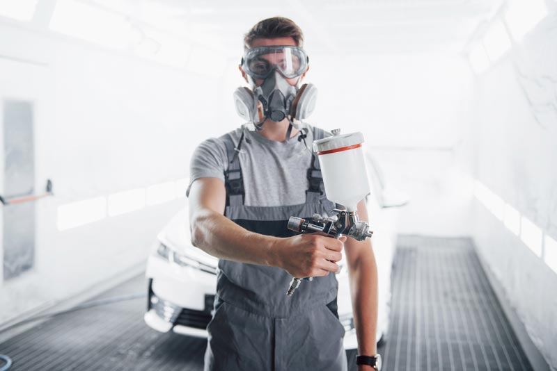 painting a car in the service center